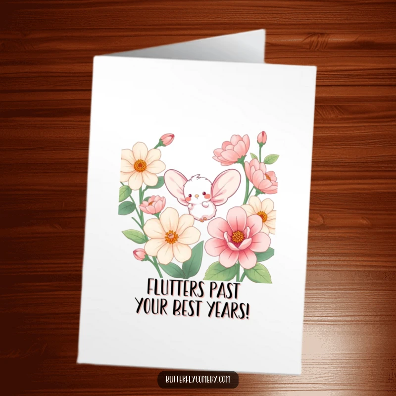 Funny free printable birthday card featuring a small fluffy creature with large wings amidst giant flowers, fluttering happily.